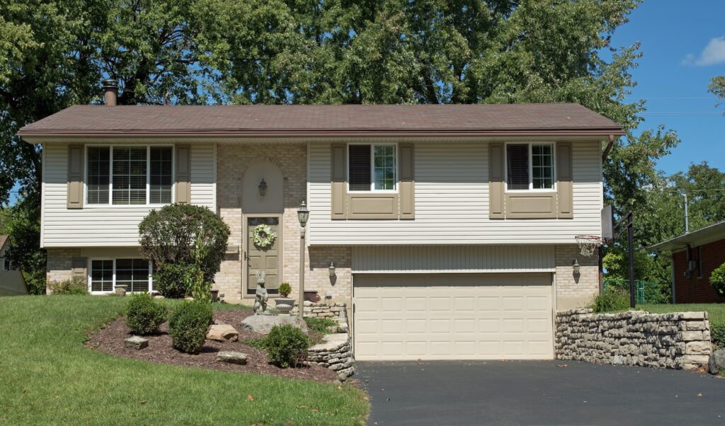 White, Split-level House With Lower Garage